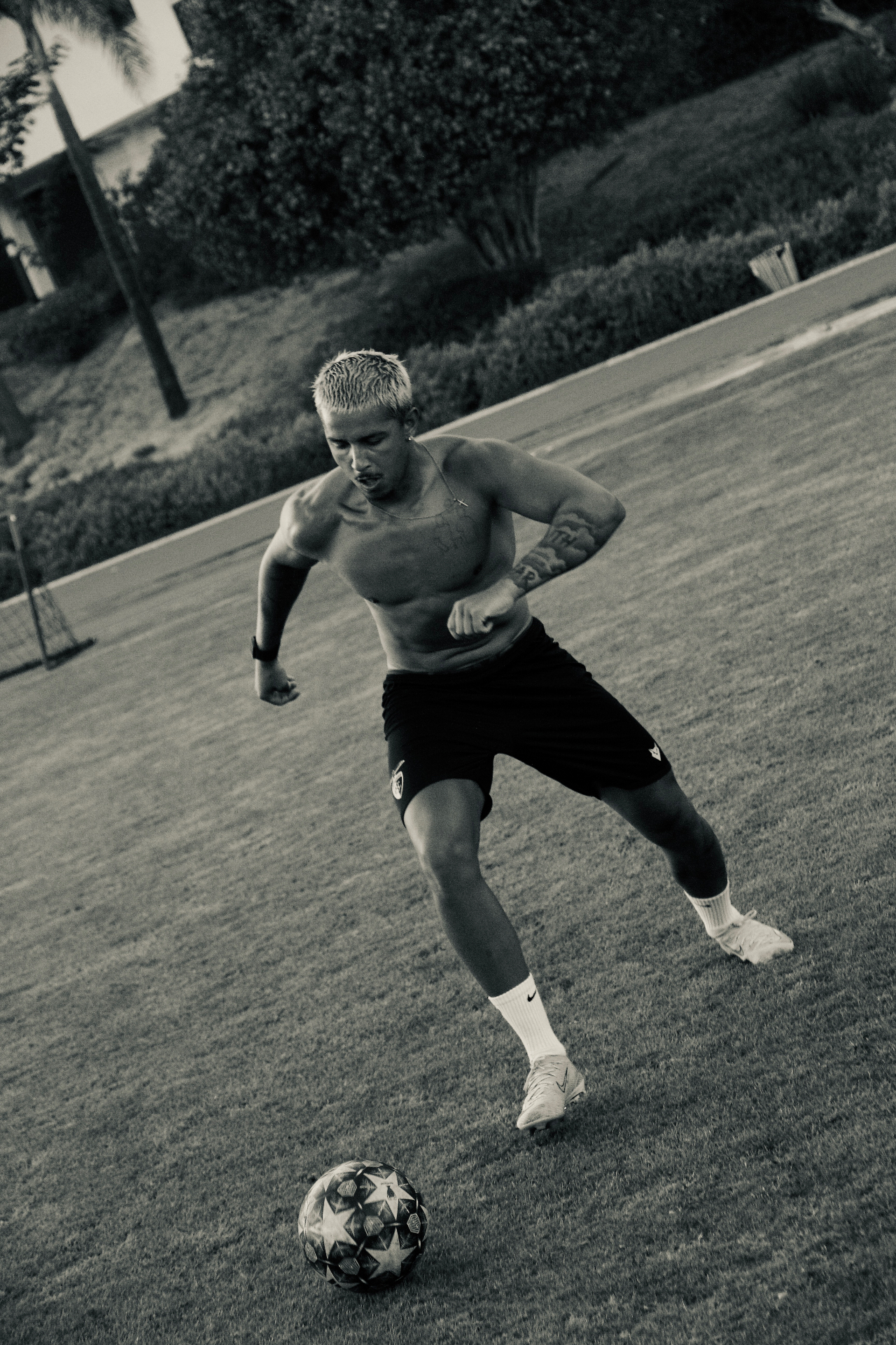 Driving the ball forward — black and white action frame