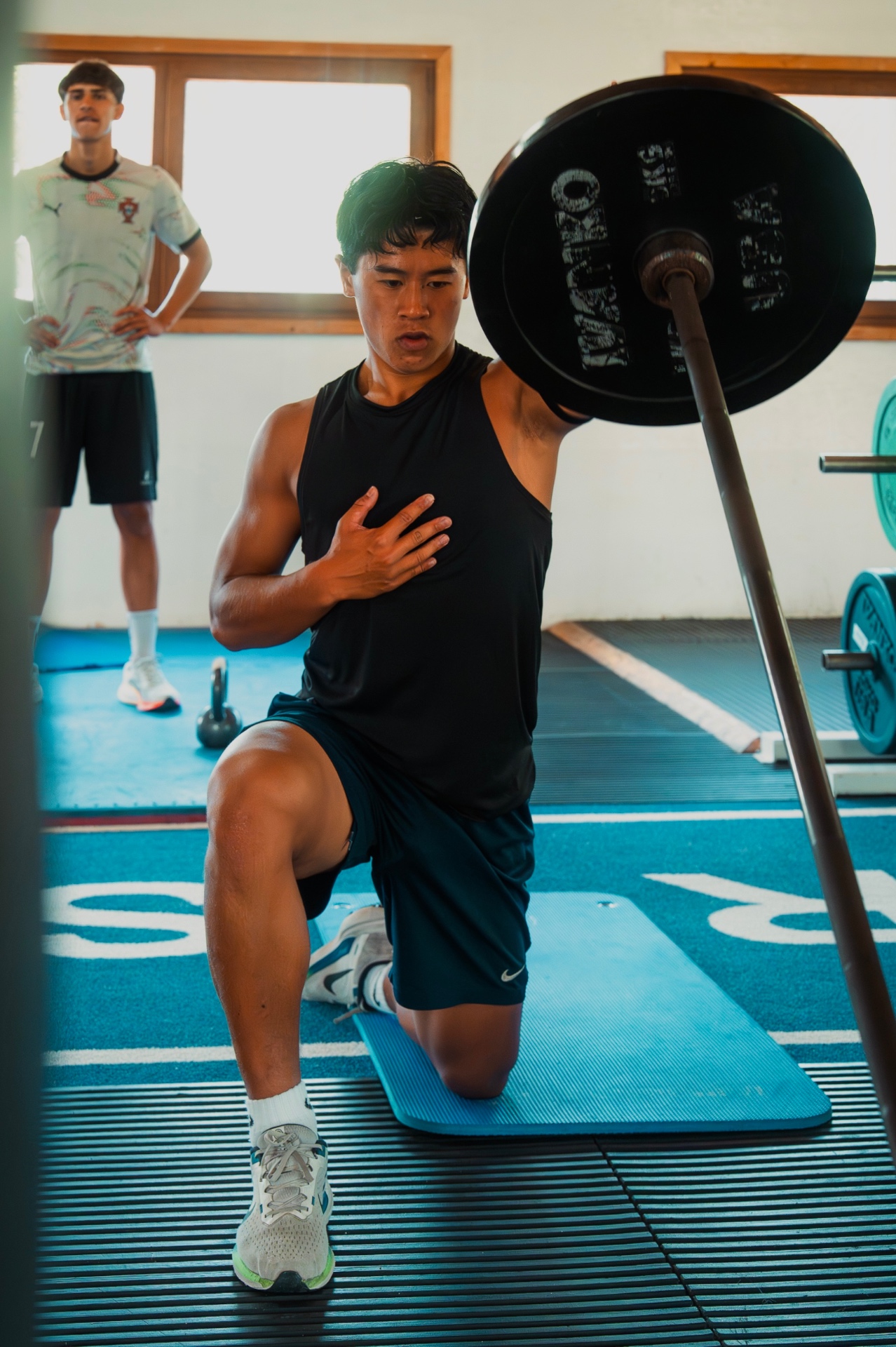 Loaded split-squat — controlled power under the bar